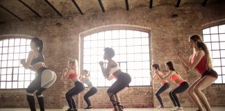 group of women doing exercise inside the building