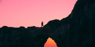 Active Fun Around Orange County: A Newcomer’s Guide silhouette of man on rock walking during nightime